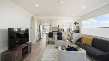 Deluxe House, 3 Bedrooms, Ocean View | Living area | 55-inch flat-screen TV with digital channels