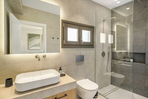 Executive Suite, City View | Bathroom | Shower, free toiletries, hair dryer, slippers - The Old Distillery Premium Suites (Rethymno)