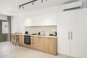 Executive Suite, City View | Private kitchen | Mini-fridge, oven, stovetop, espresso maker