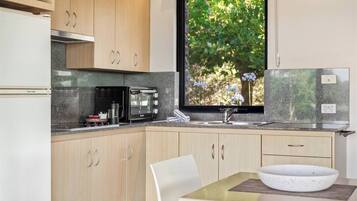 Fridge, microwave, stovetop, coffee/tea maker