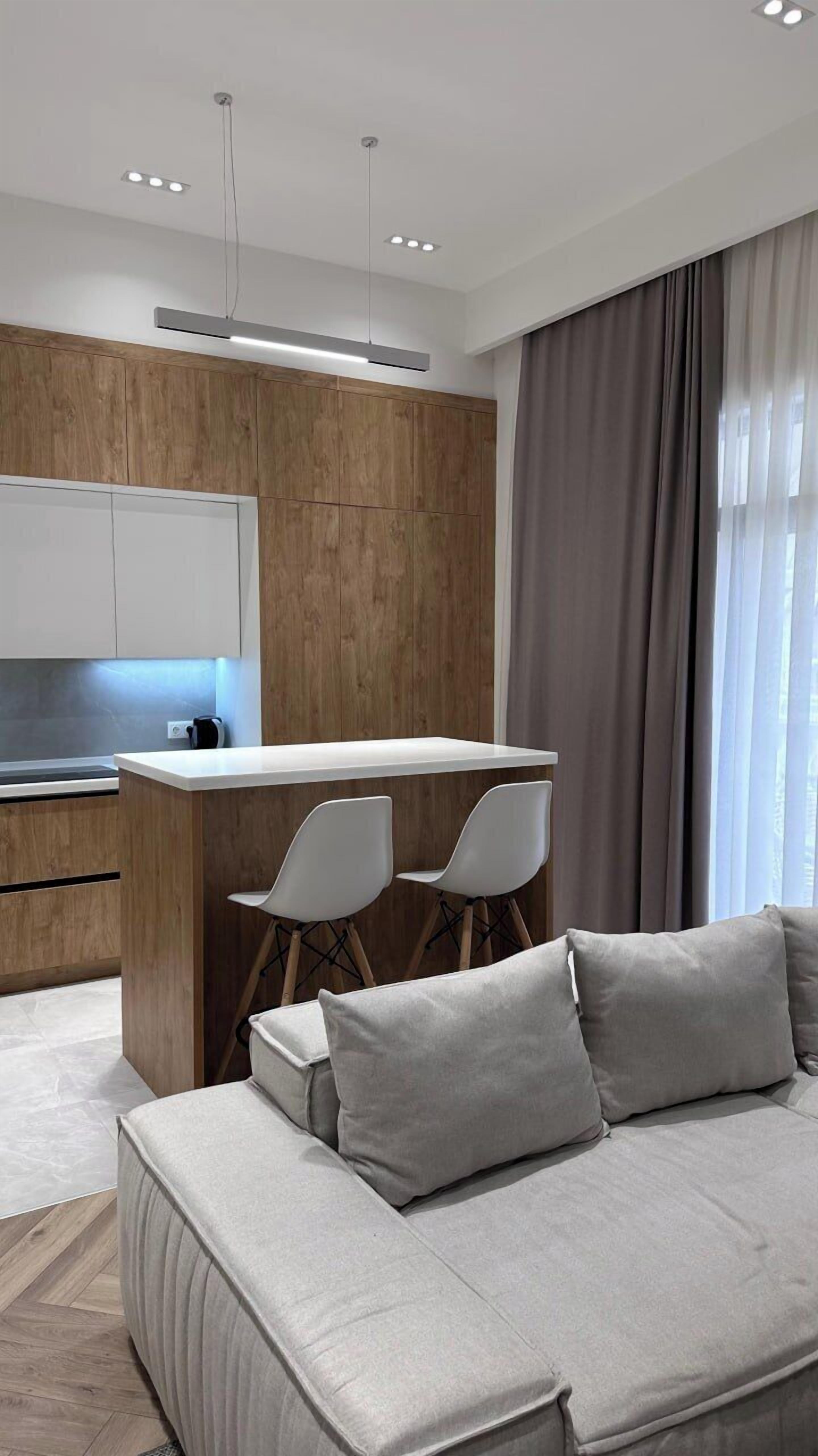 Luxury Apartment, Courtyard View | Living area | Flat-screen TV