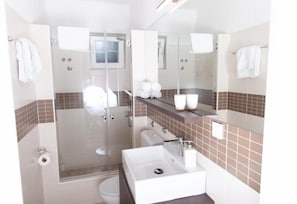 Shower, towels, soap, toilet paper