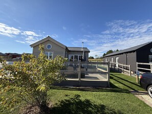 A residential property with a fenced patio, a swimming pool, and a covered outdoor area. - Alana Bay - a beautiful meadow lodge at The Bay Filey (Filey)
