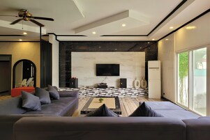 Luxury Villa | Living area | 59-inch flat-screen TV with digital channels