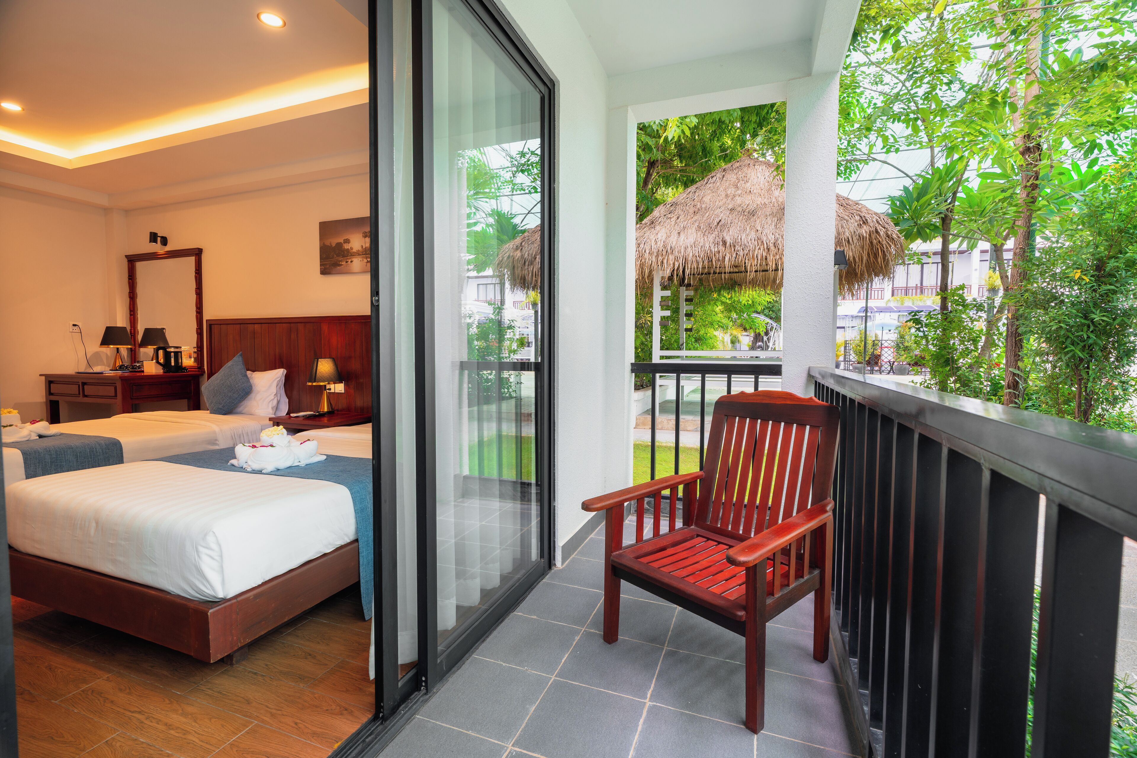 Deluxe Twin Room with Balcony, Garden View | Minibar, in-room safe, desk, laptop workspace