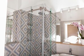 Shower, towels, soap, toilet paper