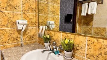 Twin Room | Bathroom | Hair dryer, slippers, soap, shampoo
