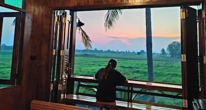 Charming Thai-style villa in lush greenery 10 mins from bus station near city.