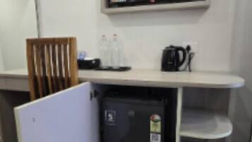 Double or Twin Room, City View | Living area | TV