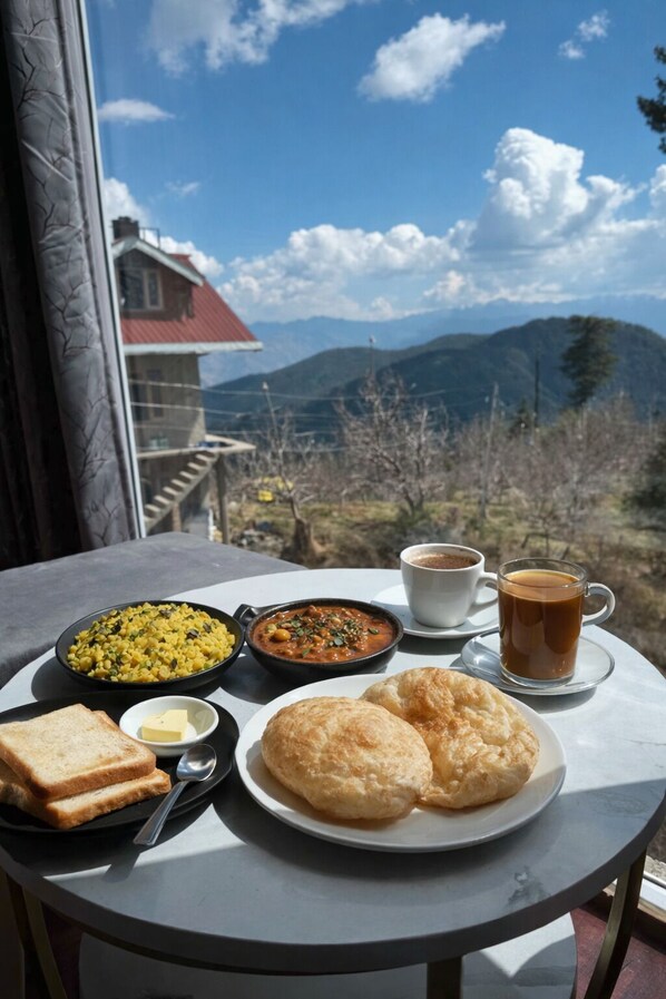A table with a meal consisting of bread, butter, a bowl of soup, and two cups of coffee, set against a scenic mountain backdrop. - White Castle Himalayan View by Lavenders Hotels (Shimla)