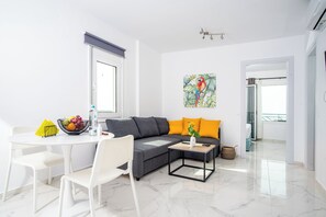 Athinais Suites A1 | Living area | 45-inch Smart TV with cable channels