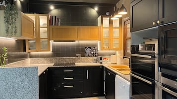 Villa | Private kitchen | Fridge, microwave, oven, stovetop