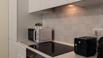 Deluxe Apartment, Garden View | Private kitchen | Full-sized fridge, microwave, oven, stovetop