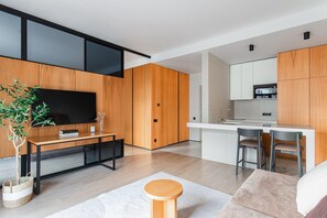 Luxury Apartment, Courtyard View | Living area | Flat-screen TV