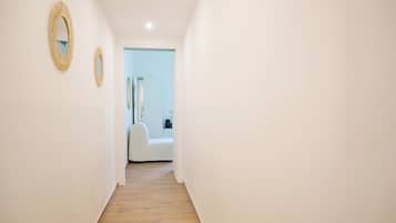 Deluxe Triple Room | Desk, laptop workspace, blackout curtains, iron/ironing board
