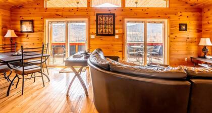 Charming riverside with stunning views, cozy interiors, full amenities, and spacious decks.