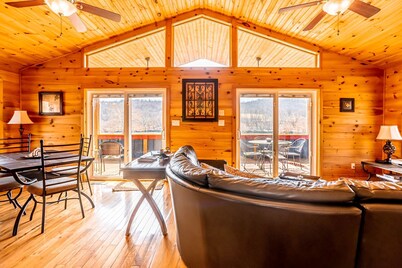 Charming riverside with stunning views, cozy interiors, full amenities, and spacious decks.