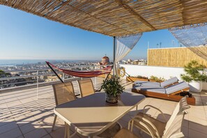 Outdoor dining - City's Balcony with the best city view, Friends-inspired design, and parking (Sikies)