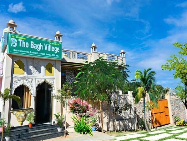 A traditional building with a sign reading "The Bagh Village." - Hotel The Bagh Village (Sawai Madhopur)
