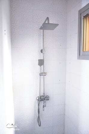 Shower, towels, soap, toilet paper