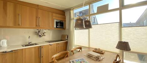 Dishwasher, toaster, dining tables