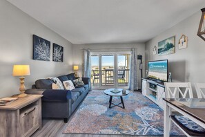 Signature Condo, Pool Access, Beach View | Living room | 50-inch Smart TV with satellite channels - The Victorian Condos (Galveston)