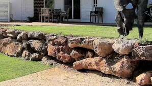 A two-story house with a patio area, a stone wall, and a sculpture. - Casa Vale vinagre - Villa large pool for max. 8 persons (São Bartolomeu de Messines)