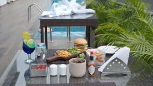A table with a meal, a drink, and a bottle of Tabasco sauce. - Clarion Hotel Khayal Kochi, Infopark (Kanayannur)