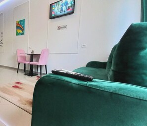 Studio, plusieurs chambres, vue jardin | Salle de séjour