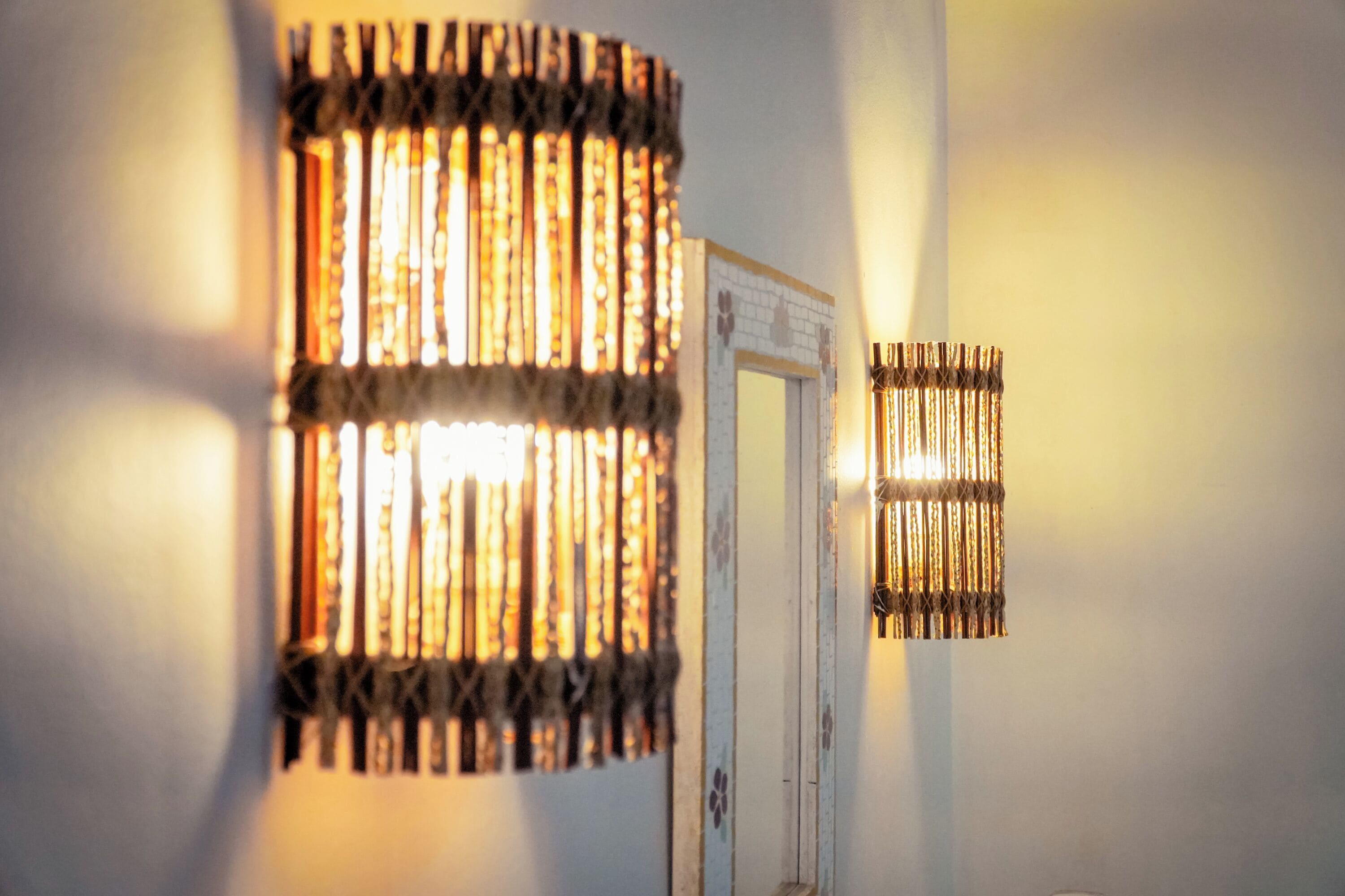 A wall-mounted light fixture with a patterned design.