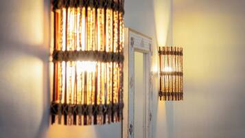 A wall-mounted light fixture with a patterned design.