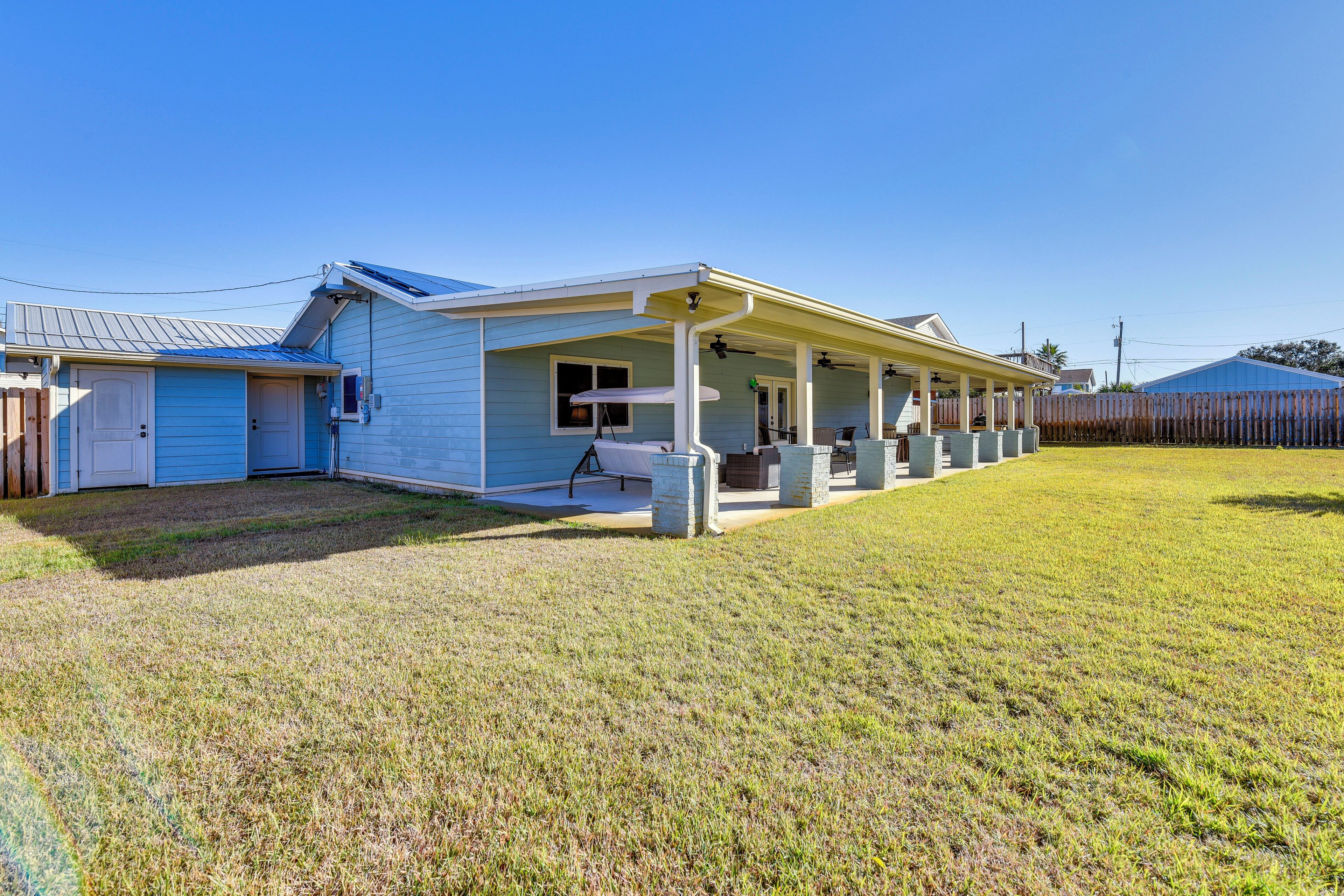 A single-story house with a covered porch, a small attached garage, and a well-maintained lawn.