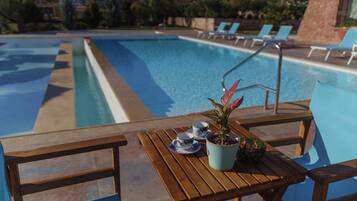 Outdoor pool, pool umbrellas, sun loungers
