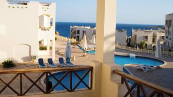 Deluxe Room, Pool View | Bathroom | Separate bathtub and shower, towels, soap, shampoo