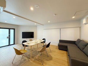 Comfort Apartment | Living area | 65-inch TV with digital channels - Celine Kanayama 101 (Hiroshima)