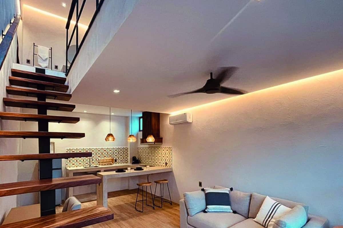 Senior Duplex, 1 Bedroom, Pool View | Living area | 50-inch Smart TV with digital channels, Netflix, streaming services