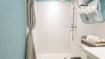 Shower, towels, soap, toilet paper