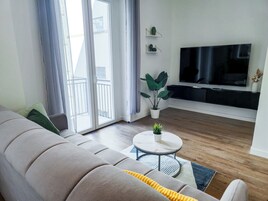 Superior Apartment, Balcony | Living area | Flat-screen TV