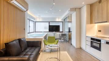 Queen Suite Elea | Living area | 55-inch plasma TV with cable channels, smart speakers