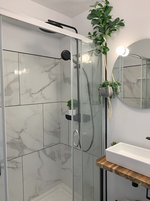 Shower, hair dryer, towels, soap