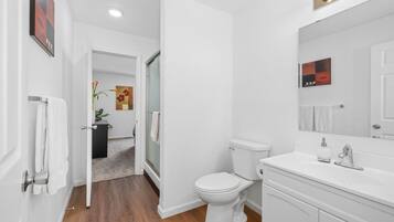 Shower, hair dryer, towels, toilet paper