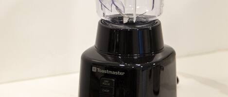 A Toastmaster blender on a white countertop.