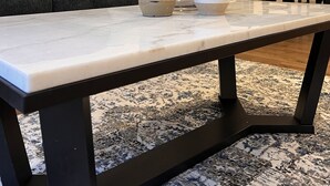 A dining table with a white marble top, a white ceramic vase, and a white bowl. - Luxury Views, Affordable Stay A306 (Juneau)