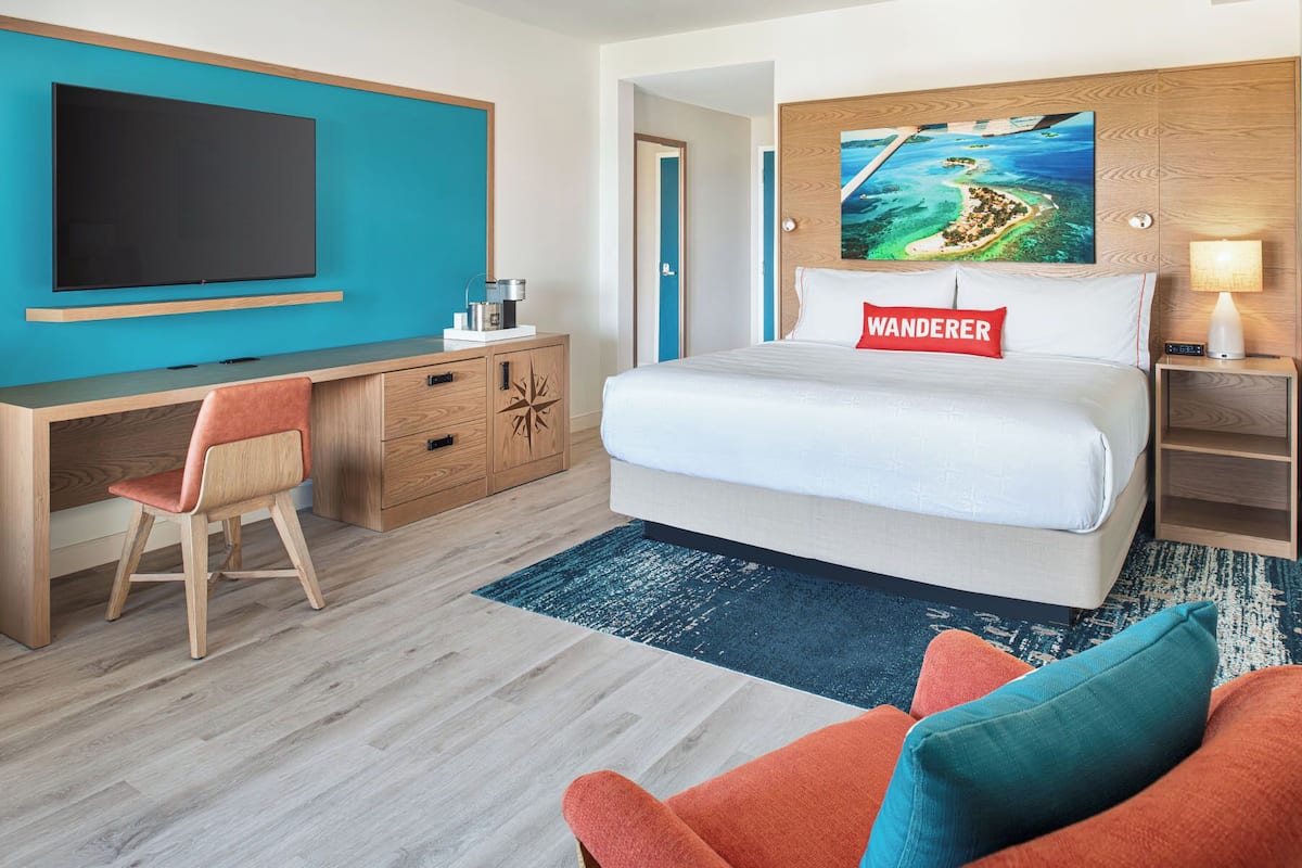 Deluxe Room, 1 King Bed, Balcony, Ocean View | Iron/ironing board, WiFi (free), bed sheets