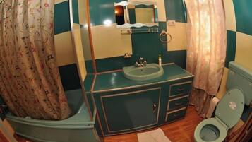 Combined shower/tub, free toiletries, hair dryer, slippers