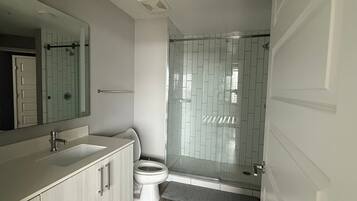 Shower, hair dryer, towels, soap