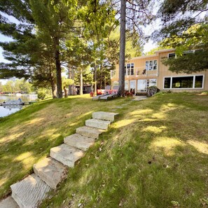 Property grounds - Beautiful Lakefront cabin w/woodburning fireplace, parking, grill, canoe, SUP. (Wautoma)