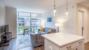 Deluxe Apartment, Kitchen, Courtyard View | Living area - Atlantic Station West - 8T (Stamford)