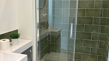 Shower, hair dryer, towels, soap