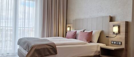 Premium bedding, down duvets, minibar, in-room safe
